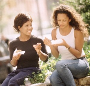 Friends Eating Lunch Outdoors --- Image by © Steve Prezant/CORBIS
